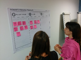 two women looking at a lean startup poster